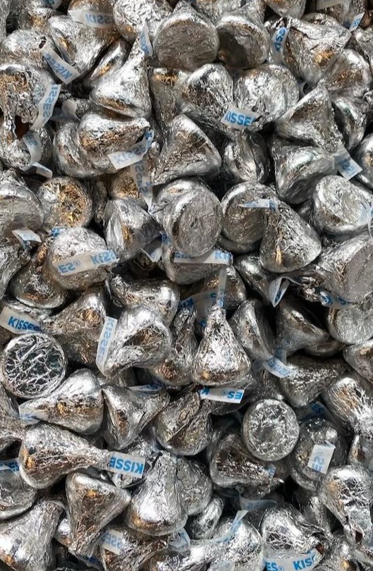 A pile of foil-wrapped Hershey's Kisses