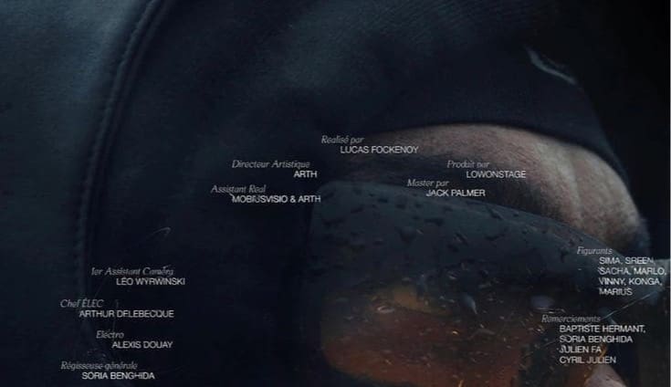 Film credits frame with names in columns under role labels