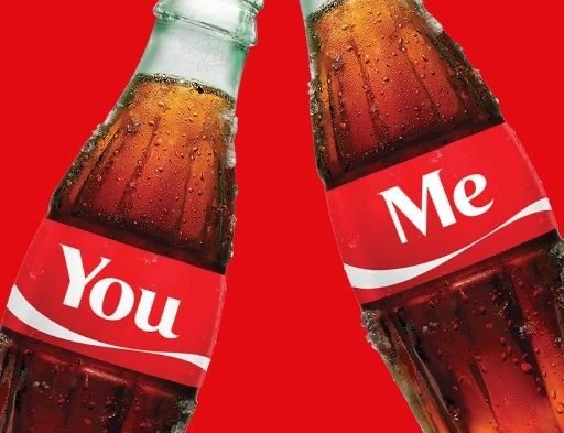 Two Coke bottles labelled You and Me on red