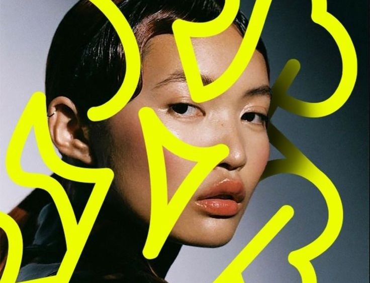 Acid-yellow hand-drawn letters over a fashion portrait
