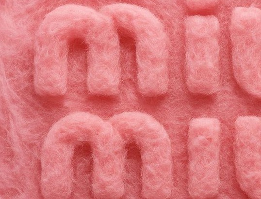 Fuzzy pink felt letters on a fuzzy pink ground