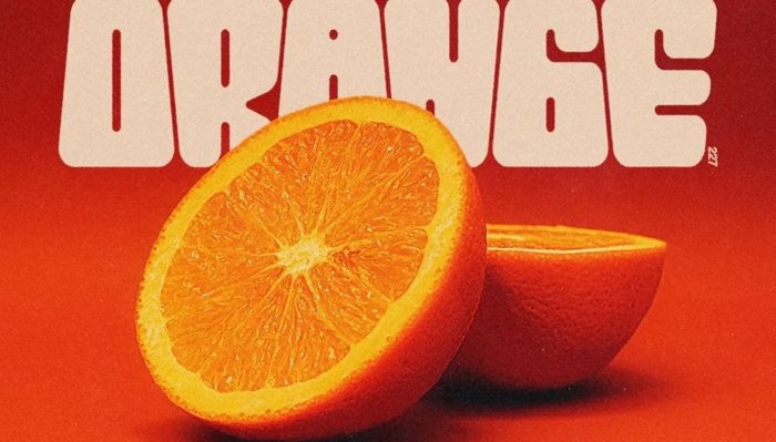 Fat seventies letters above a split real orange